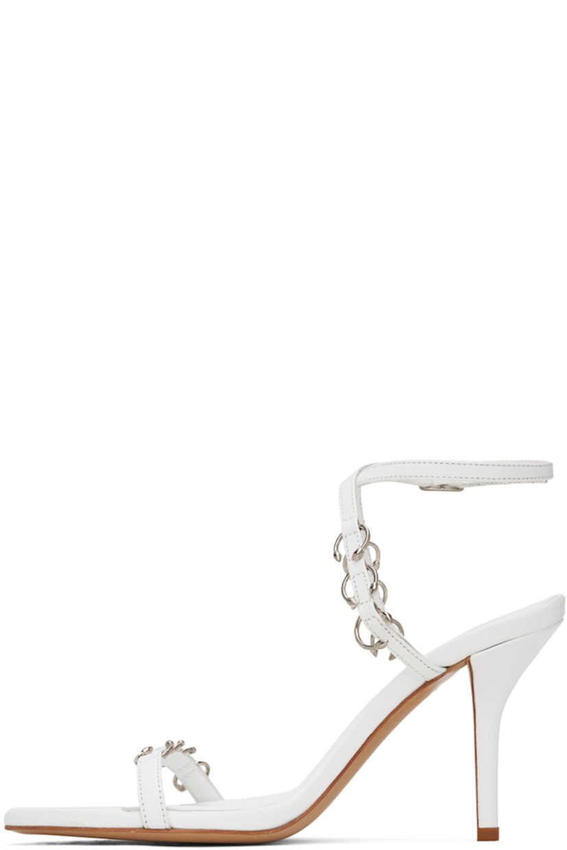 Buffed nappa leather heeled sandals in white.

· O-rings throughout
· Open pointed toe
· Strap at vamp
· Adjustable pin-buckle ankle strap
· Logo embossed at padded footbed
· Covered stiletto heel with rubber injection
· Leather sole
· Heel: H3.5"

Part of the Miaou x GIABORGHINI collaboration.

Supplier color: White
