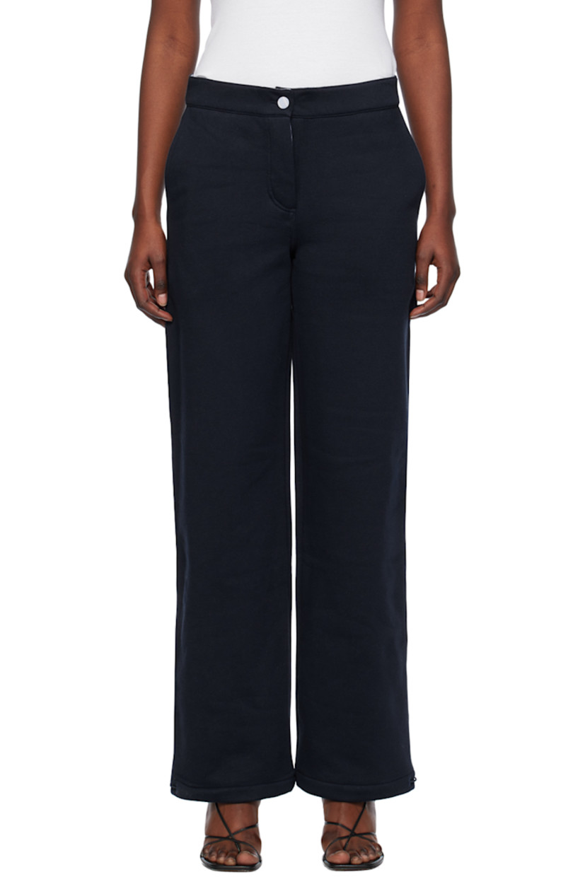 Loose-fit straight-leg organic cotton fleece lounge pants. 

· Elasticized waistband
· Four-pocket styling
· Button-fly
· Elasticized drawstring at cuffs
· Patch pocket and hammer loop at back
· Partial cotton poplin lining

Supplier color: Navy