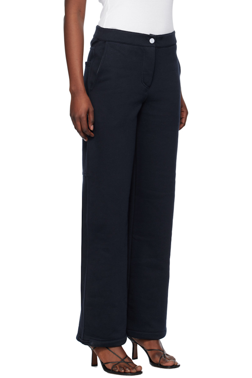Loose-fit straight-leg organic cotton fleece lounge pants. 

· Elasticized waistband
· Four-pocket styling
· Button-fly
· Elasticized drawstring at cuffs
· Patch pocket and hammer loop at back
· Partial cotton poplin lining

Supplier color: Navy