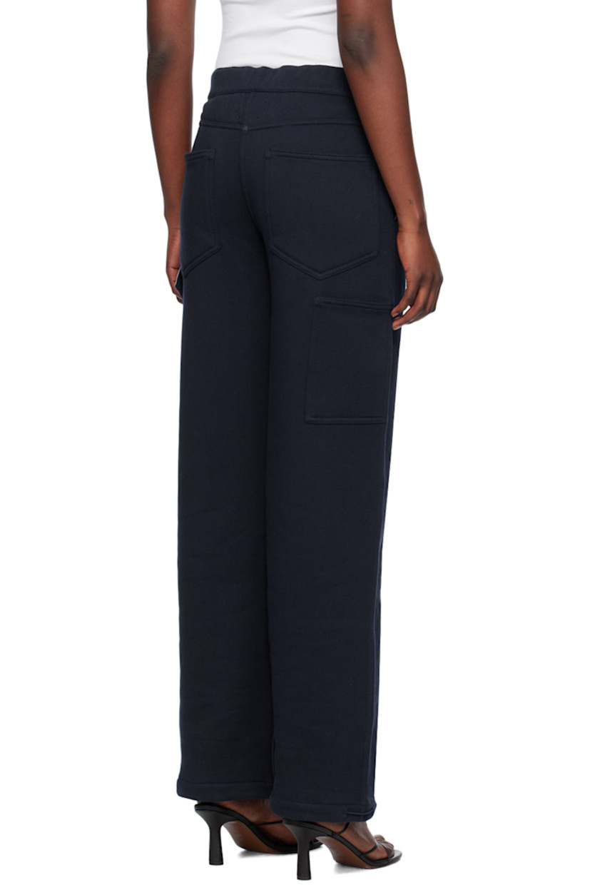 Loose-fit straight-leg organic cotton fleece lounge pants. 

· Elasticized waistband
· Four-pocket styling
· Button-fly
· Elasticized drawstring at cuffs
· Patch pocket and hammer loop at back
· Partial cotton poplin lining

Supplier color: Navy