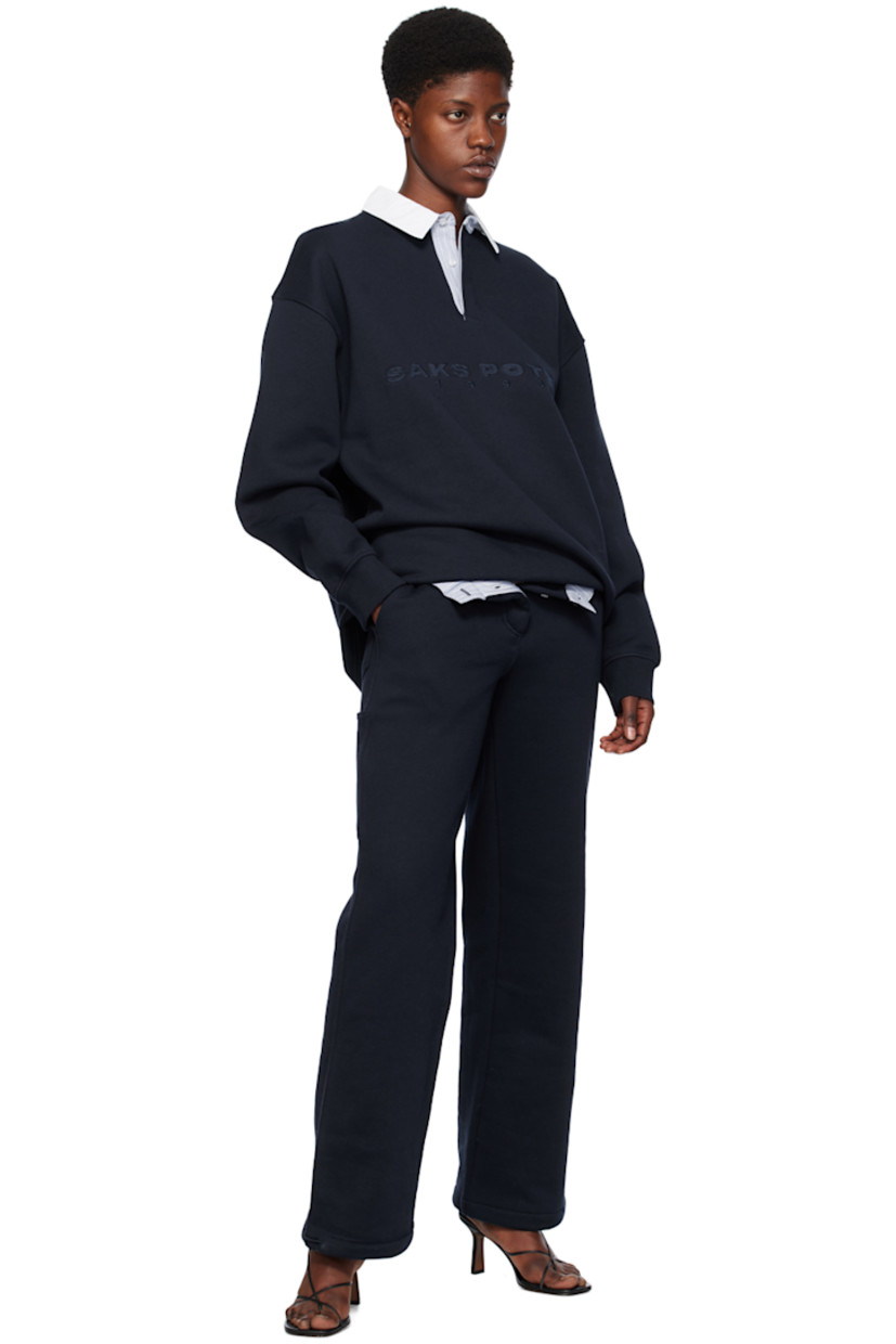Loose-fit straight-leg organic cotton fleece lounge pants. 

· Elasticized waistband
· Four-pocket styling
· Button-fly
· Elasticized drawstring at cuffs
· Patch pocket and hammer loop at back
· Partial cotton poplin lining

Supplier color: Navy