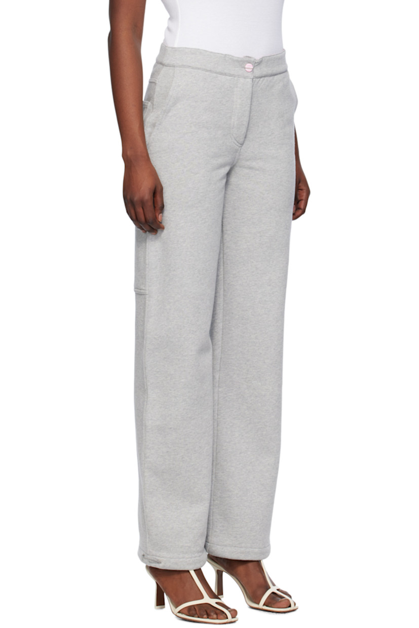 Loose-fit straight-leg organic cotton fleece lounge pants. 

· Elasticized waistband
· Four-pocket styling
· Button-fly
· Elasticized drawstring at cuffs
· Patch pocket and hammer loop at back
· Partial cotton poplin lining

Supplier color: Grey melange
