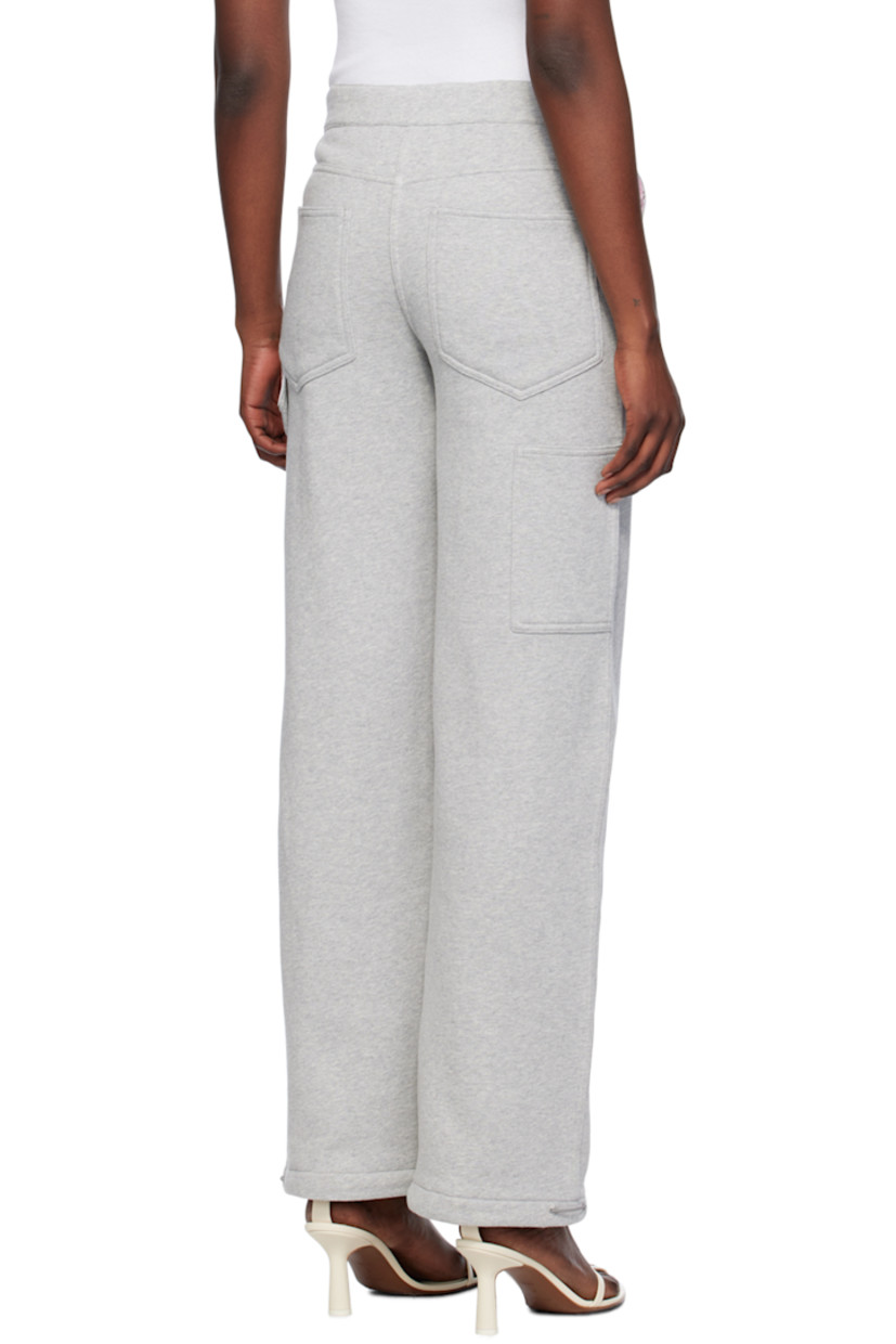 Loose-fit straight-leg organic cotton fleece lounge pants. 

· Elasticized waistband
· Four-pocket styling
· Button-fly
· Elasticized drawstring at cuffs
· Patch pocket and hammer loop at back
· Partial cotton poplin lining

Supplier color: Grey melange