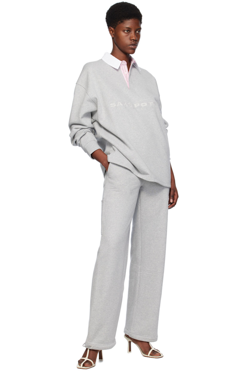 Loose-fit straight-leg organic cotton fleece lounge pants. 

· Elasticized waistband
· Four-pocket styling
· Button-fly
· Elasticized drawstring at cuffs
· Patch pocket and hammer loop at back
· Partial cotton poplin lining

Supplier color: Grey melange