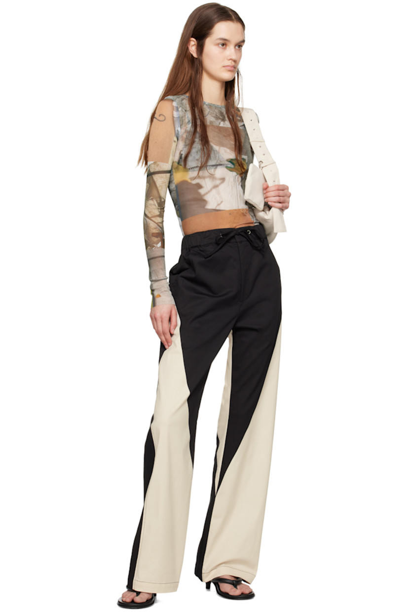 Semi-sheer stretch recycled polyester jersey T-shirt. Graphics printed throughout.

· Boat neck
· Raw edge at hem and cuffs

Supplier color: Canopy grid
