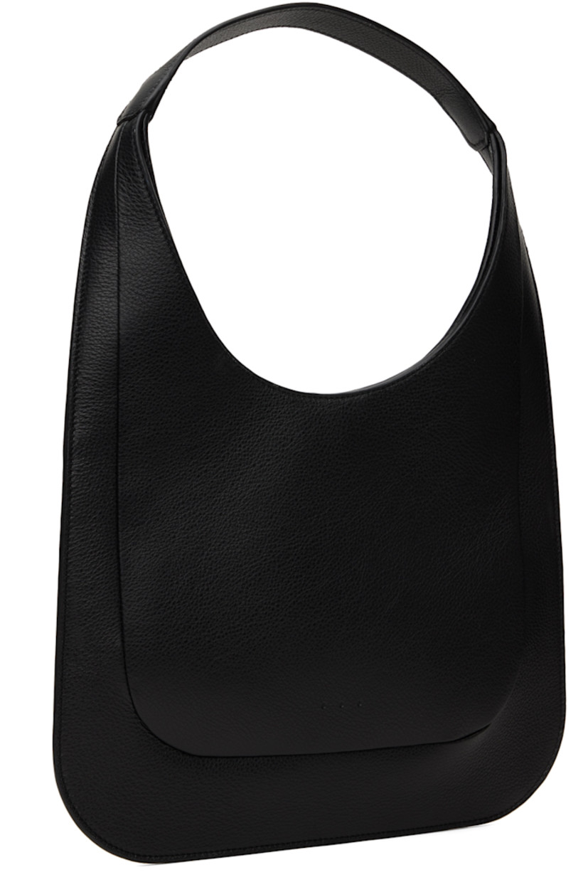 Grained calfskin shoulder bag in black.

· Integrated shoulder strap
· Logo embossed at face
· Magnetic closure
· Patch pocket at interior
· Faille lining
· H9.25" x W12"
· Total height: H17"

Supplier color: Grain black