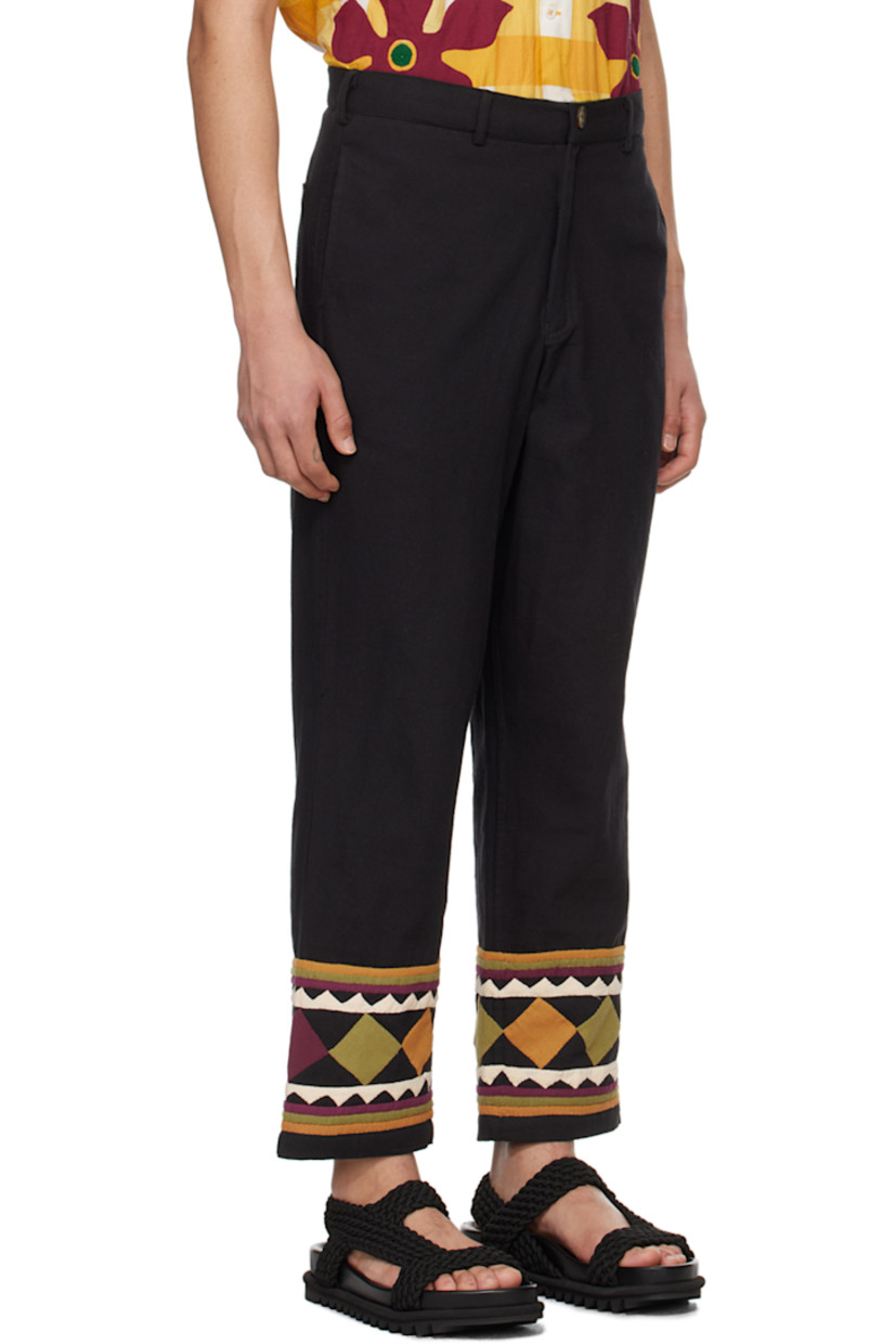 Handcrafted plain-woven cotton trousers.

· Belt loops
· Four-pocket styling
· Zip-fly
· Graphic appliqués and stripes at cuffs

Supplier color: Black