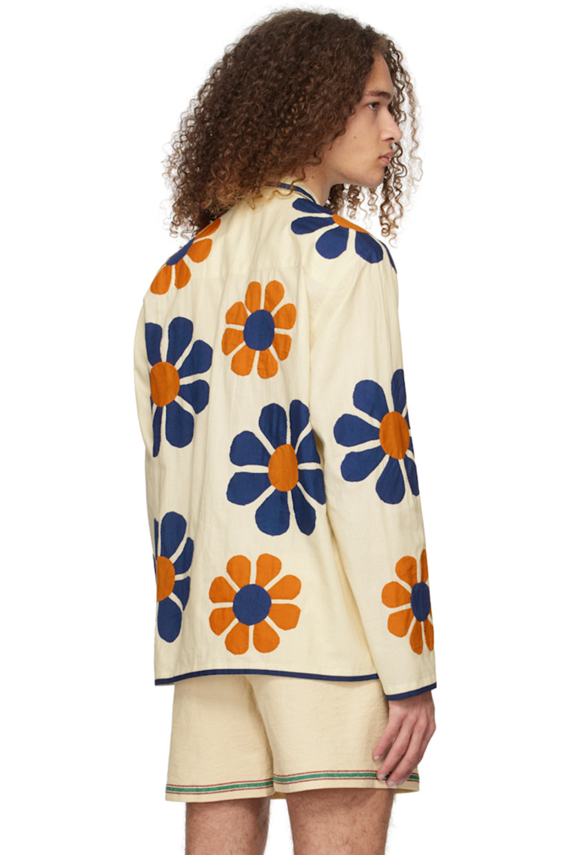 Handcrafted cotton broadcloth shirt. Floral appliqués and piping throughout.  

· Open spread collar
· Button closure

Supplier color: Off-white