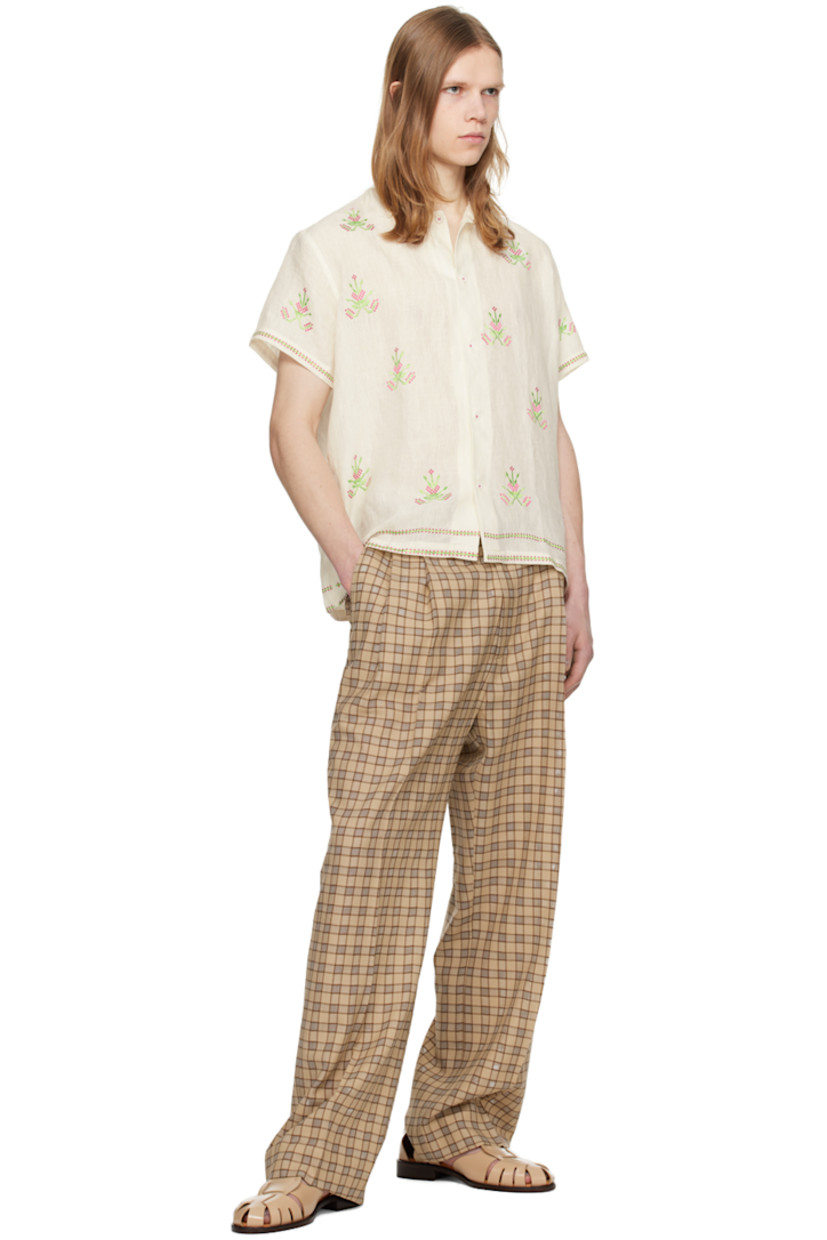 Hand-woven linen hopsack shirt. Floral pattern embroidered throughout.

· Spread collar
· Button closure
· Embroidered pattern at hem and cuffs

Supplier color: Off-White