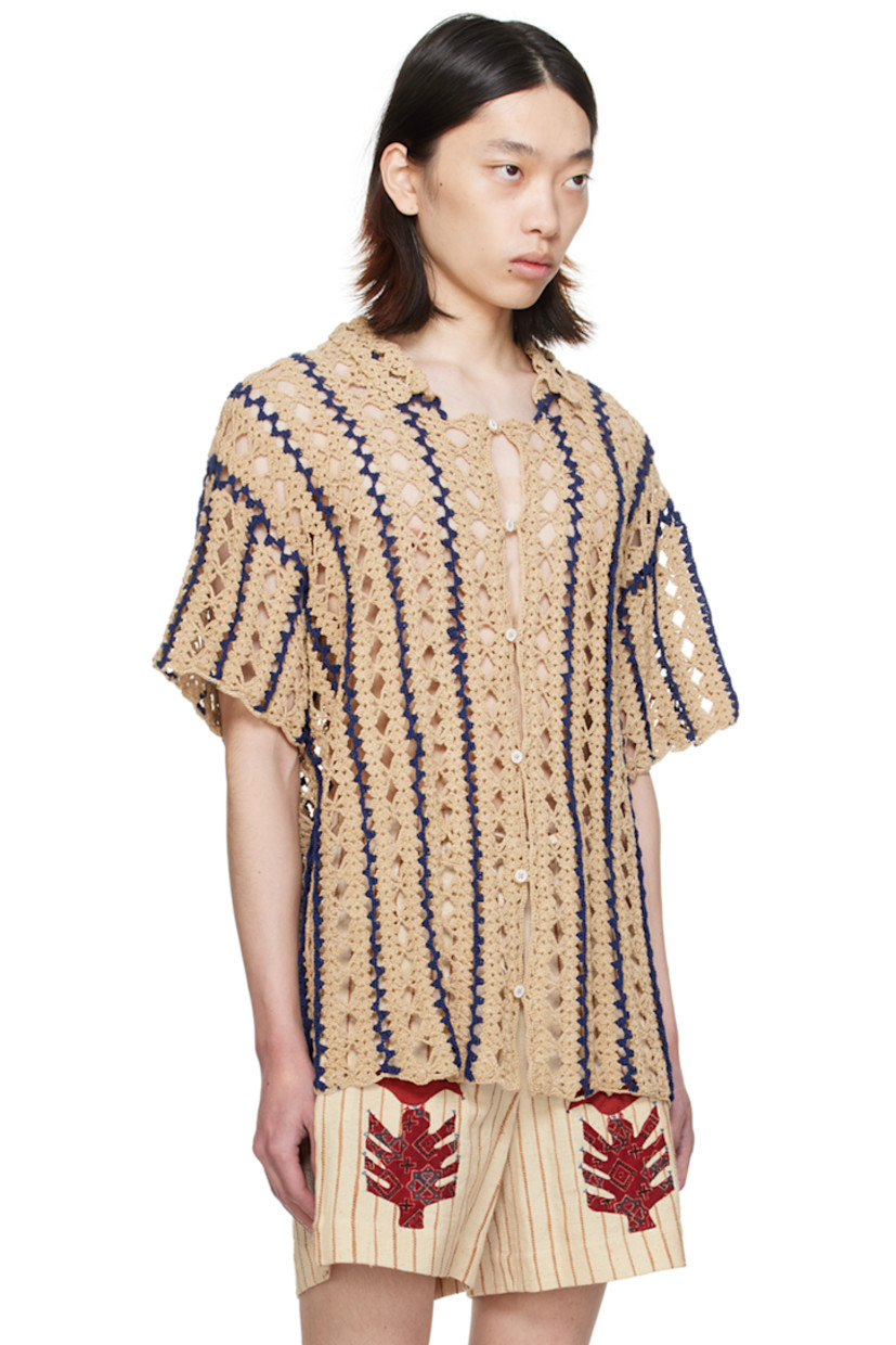 Hand-crocheted cotton shirt. Intarsia stripes and open-crocheted graphic pattern throughout.

· Spread collar
· Button closure

Supplier color: Tan