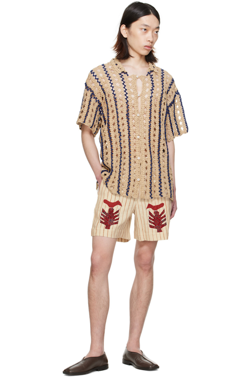 Hand-crocheted cotton shirt. Intarsia stripes and open-crocheted graphic pattern throughout.

· Spread collar
· Button closure

Supplier color: Tan