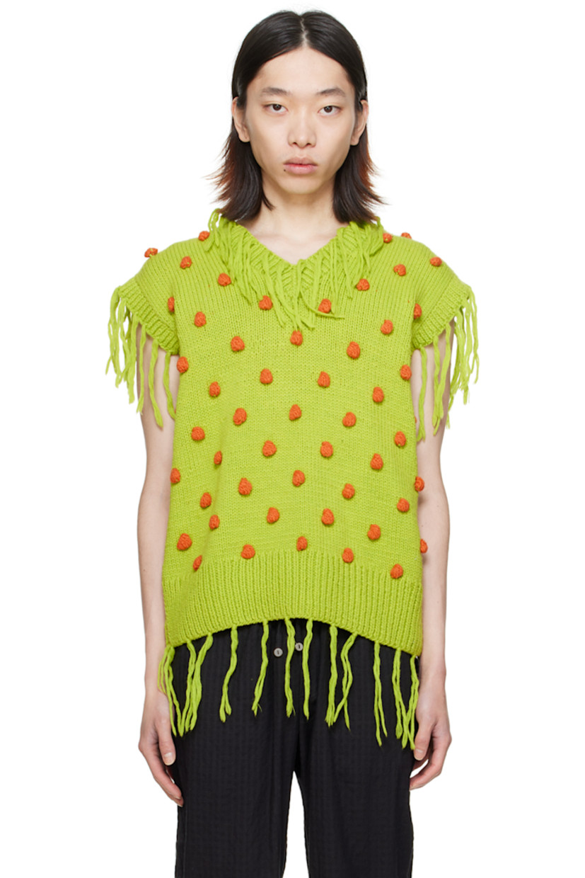 Hand-knit wool vest.

· Fringed detailing and graphic appliqués throughout
· Rib knit V-neck, hem, and armscyes

Supplier color: Green