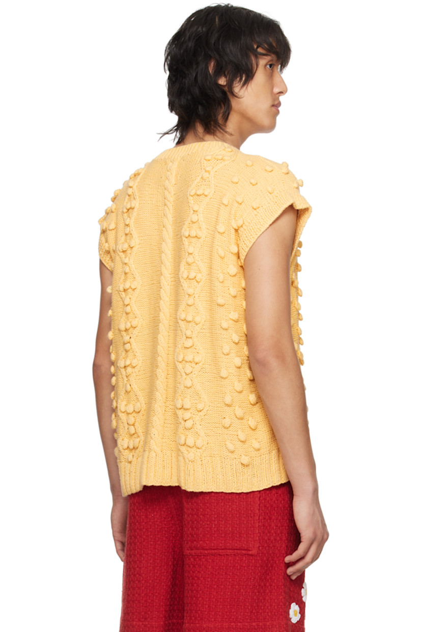 Handcrafted cable knit cotton vest. 

· Polka dot appliqué throughout
· Rib knit V-neck, hem, and armscyes

Supplier color: Beige