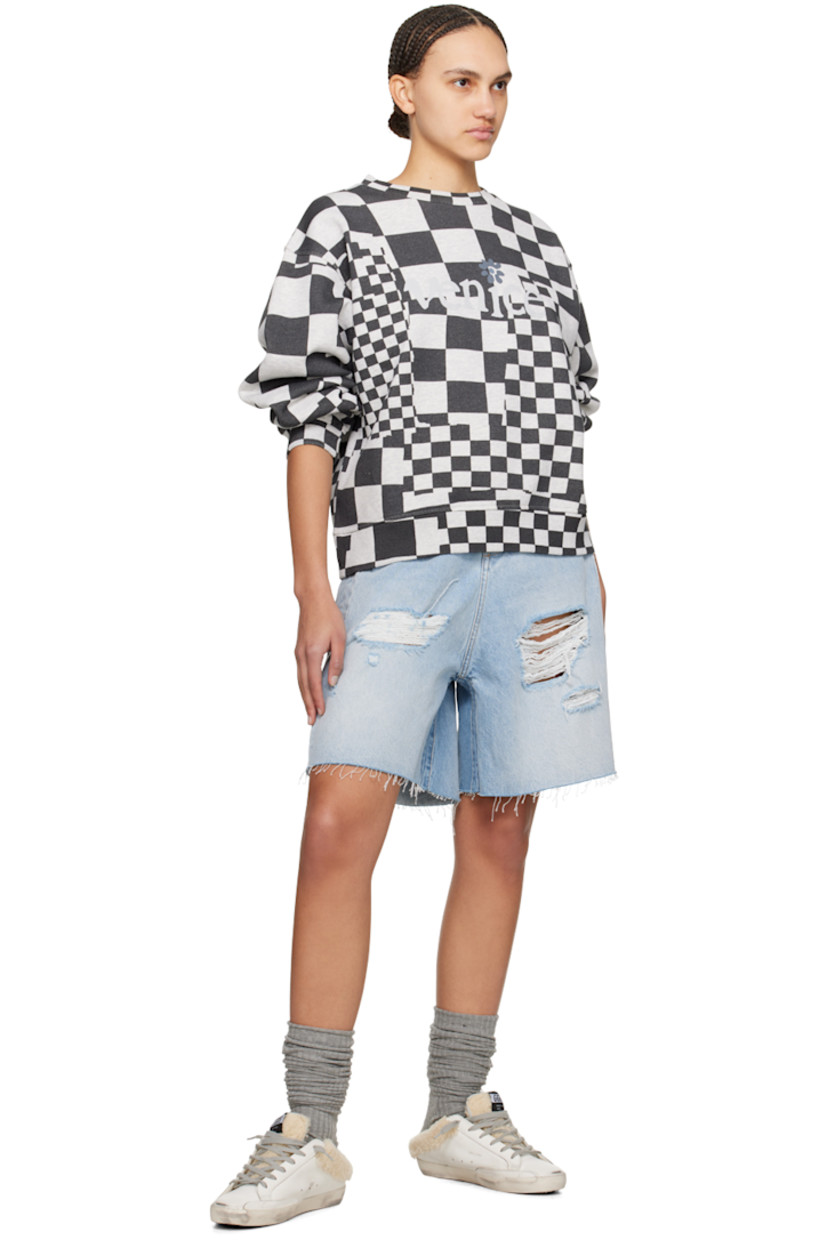 Cotton fleece sweatshirt. Check pattern printed throughout.

· Rib knit crewneck, hem, and cuffs
· Text printed at front

Supplier color: Checker