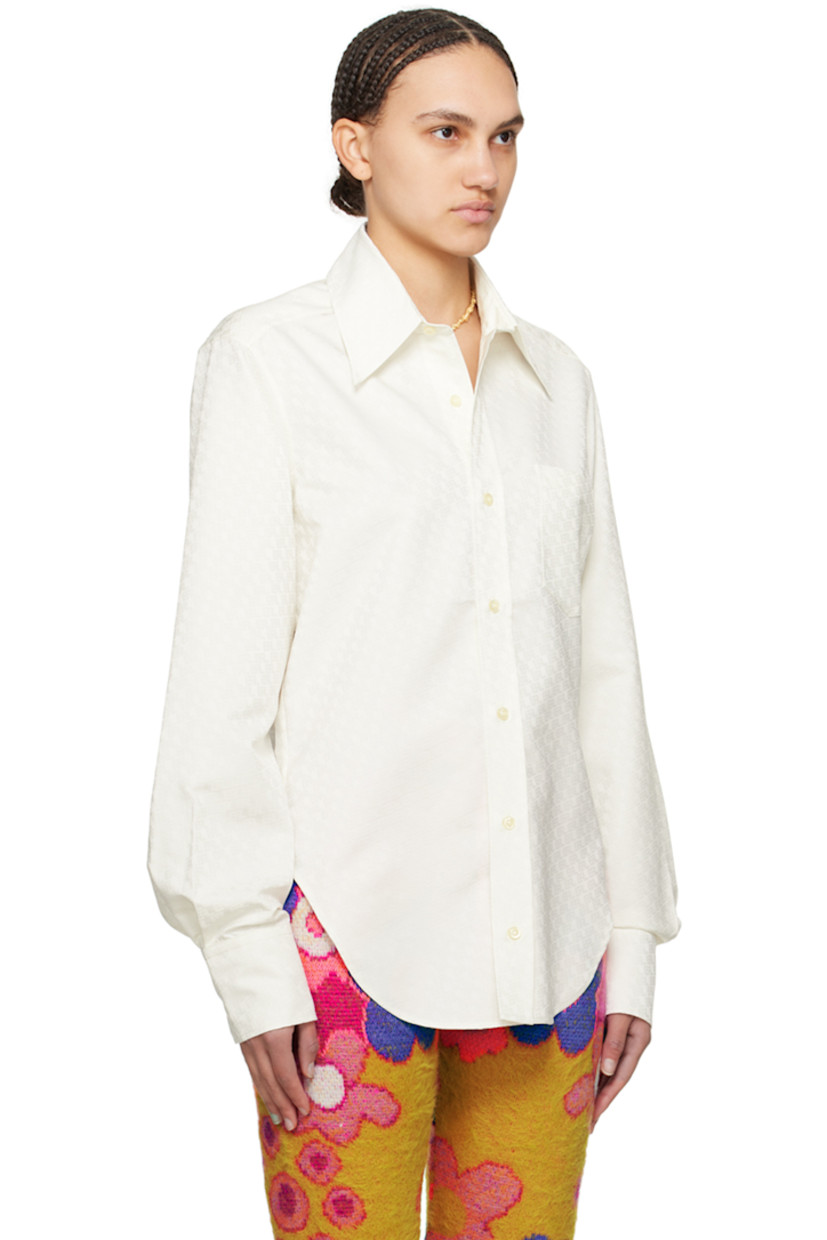 Polyester twill shirt. Jacquard logo pattern throughout.

· Spread collar
· Button closure
· Patch pocket at chest
· Two-button barrel cuffs
· Inverted box pleat at back yoke

Supplier color: Natural white