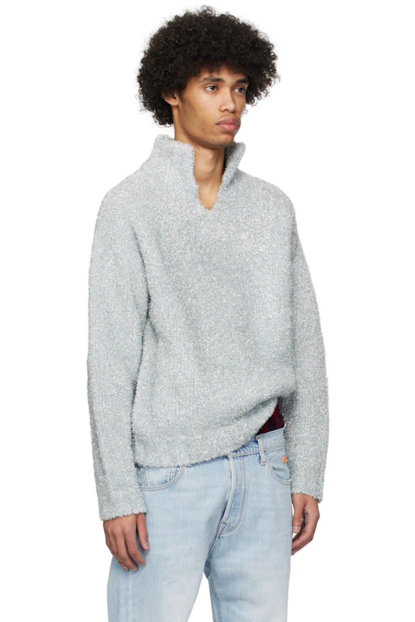 Knit polyester- and nylon-blend polo. Metallic thread detailing throughout.

· Rib knit spread collar, hem, and cuffs
· Raglan sleeves

Supplier color: Silver