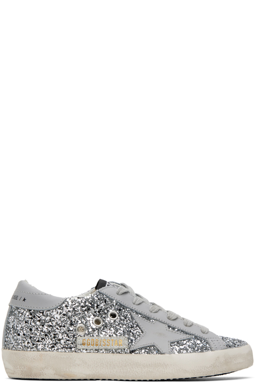 Handcrafted low-top glittered buffed leather sneakers in gray and silver tone. 

· Smudging throughout
· Lace-up closure
· Logo patch at tongue
· Padded collar
· Metal eyelets at sides
· Signature star appliqué at outer side
· Logo printed at heel tab
· Suede, buffed leather, and terrycloth lining
· Treaded rubber sole

Available exclusively at SSENSE. 

Supplier color: Grey