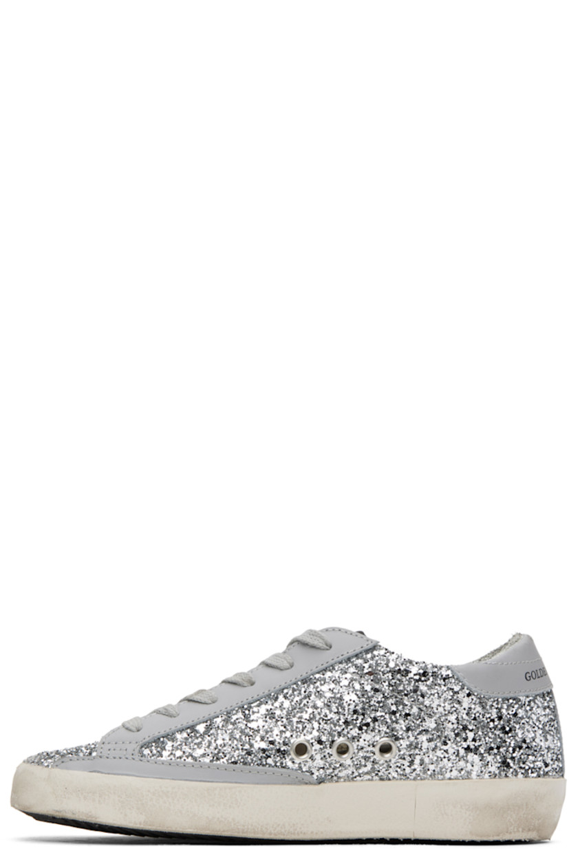 Handcrafted low-top glittered buffed leather sneakers in gray and silver tone. 

· Smudging throughout
· Lace-up closure
· Logo patch at tongue
· Padded collar
· Metal eyelets at sides
· Signature star appliqué at outer side
· Logo printed at heel tab
· Suede, buffed leather, and terrycloth lining
· Treaded rubber sole

Available exclusively at SSENSE. 

Supplier color: Grey