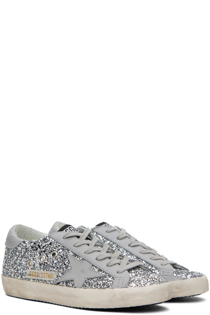 Handcrafted low-top glittered buffed leather sneakers in gray and silver tone. 

· Smudging throughout
· Lace-up closure
· Logo patch at tongue
· Padded collar
· Metal eyelets at sides
· Signature star appliqué at outer side
· Logo printed at heel tab
· Suede, buffed leather, and terrycloth lining
· Treaded rubber sole

Available exclusively at SSENSE. 

Supplier color: Grey