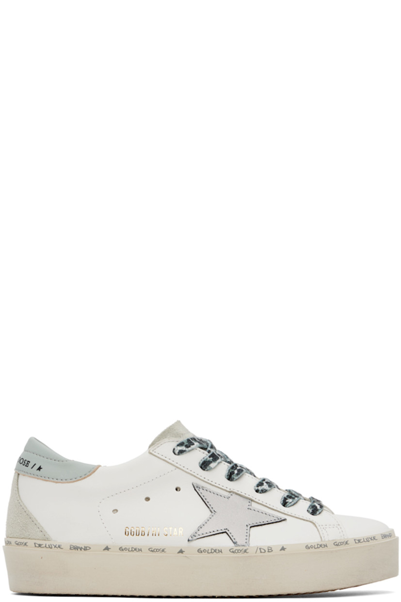 Low-top buffed leather and suede sneakers in white.

· Lace-up closure
· Logo embossed at padded tongue
· Padded collar
· Graphic appliqué at outer side 
· Gold-tone logo stamp at outer side
· Perforated detailing at sides
· Logo embossed at heel tab
· Terrycloth and microfibre lining
· Logo printed at welt
· Covered platform rubber midsole
· Treaded rubber sole
· Platform: H1.5"

Supplier color: White/Gray