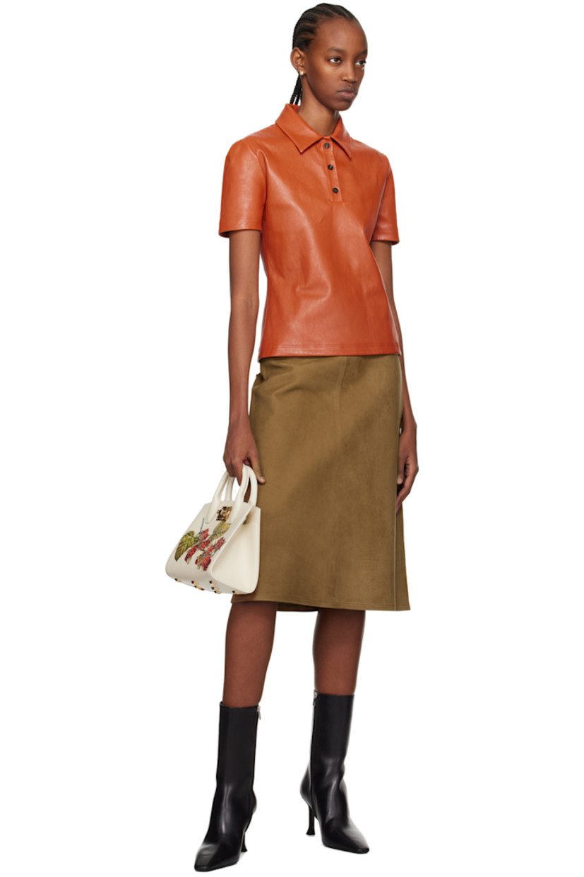 Buffalo suede skirt.

· Single-pocket styling
· Concealed zip closure at side seam
· Unlined

Supplier color: Tobacco