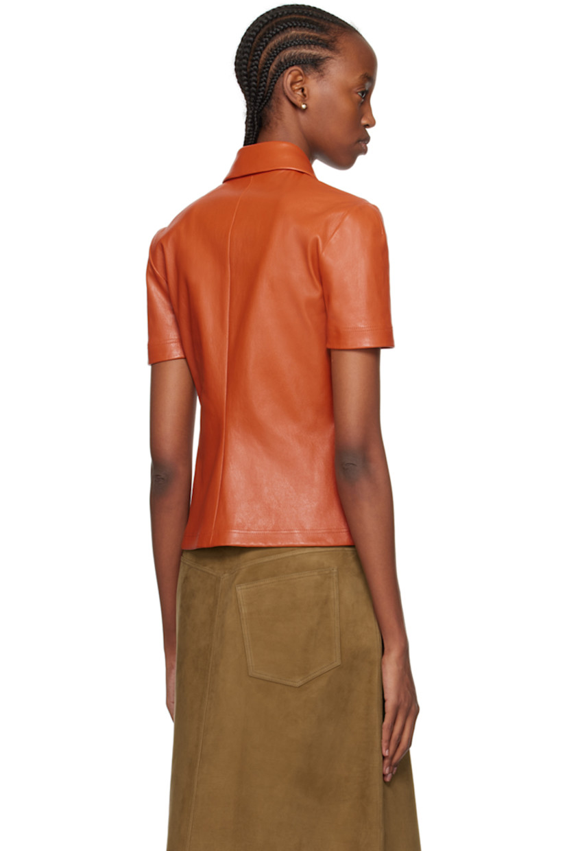 Grained nappa lambskin polo.

· Spread collar
· Three-button placket
· Unlined

Supplier color: Terracotta
