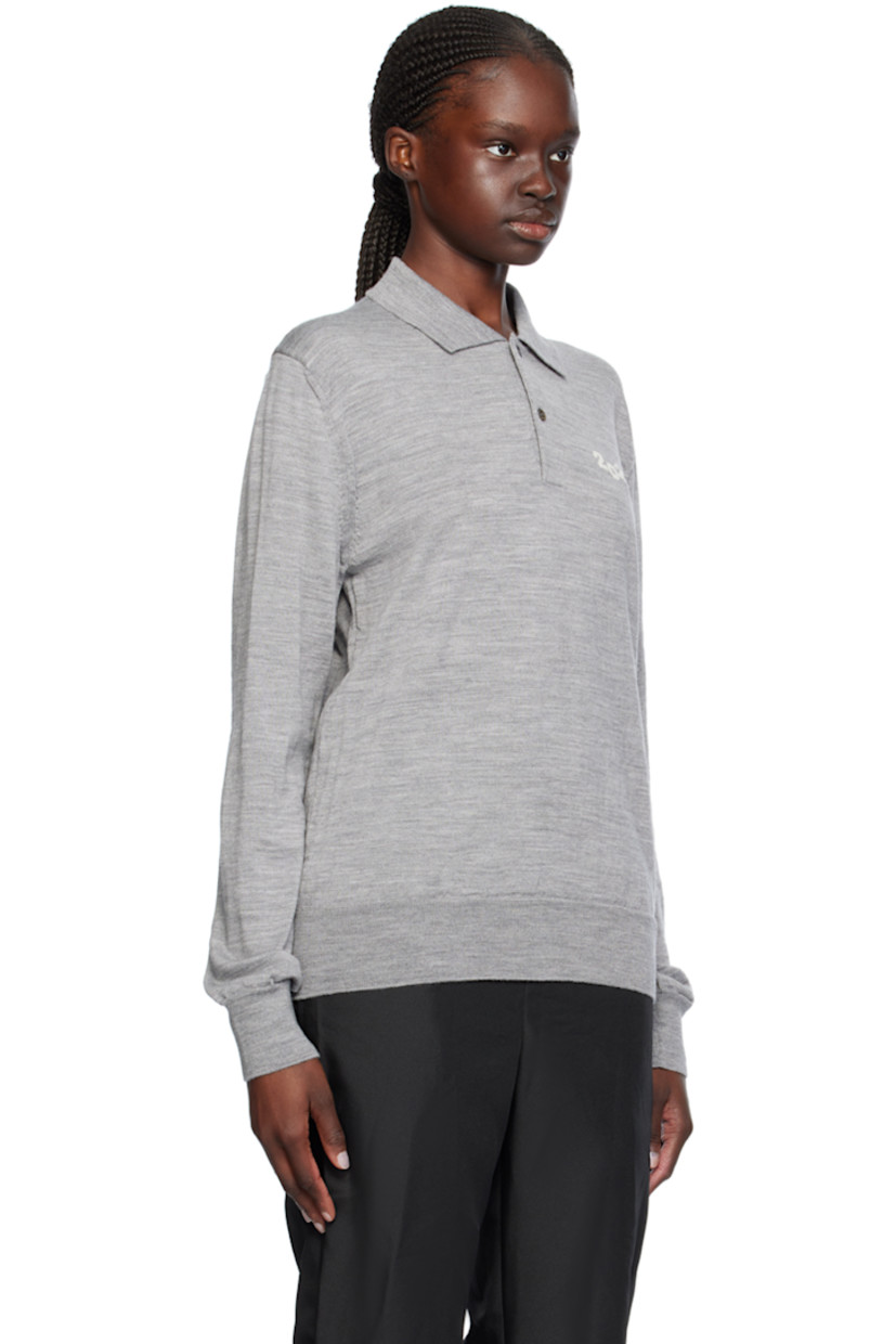 Knit wool polo.

· Rib knit spread collar, hem, and cuffs
· Two-button placket
· Intarsia text at chest

Supplier color: Gray