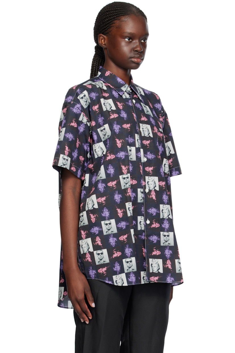 Cotton poplin shirt. Graphic pattern printed throughout.

· Spread collar
· Button closure
· Patch pocket
· Droptail hem
· Box pleat at back yoke
· Contrast stitching in white

Part of the Comme des Garçons Shirt Andy Warhol capsule collection.

Supplier color: Print F