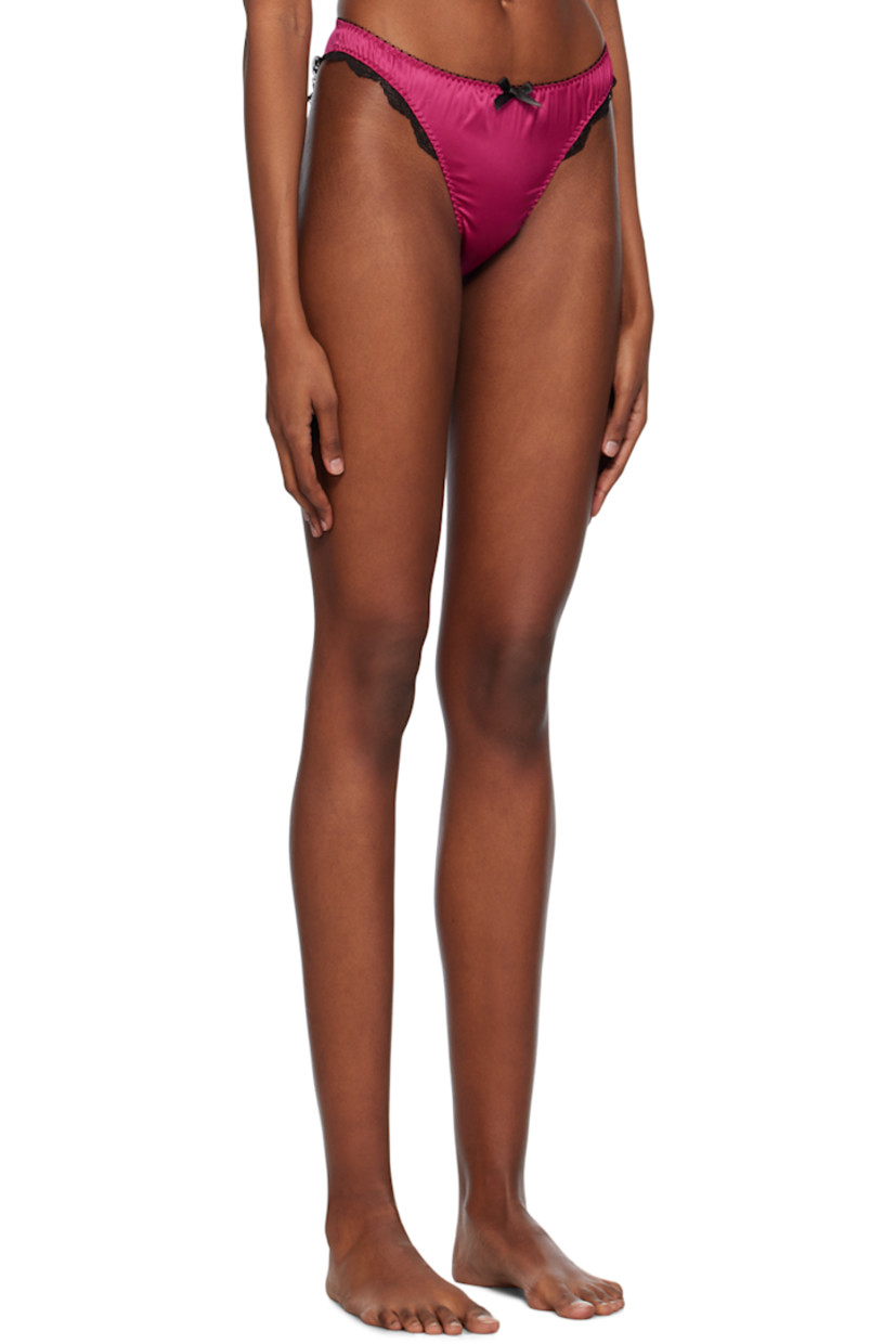 Stretch polyester satin briefs. Scalloped lace trim throughout.

· Elasticized waistband 
· Bow appliqué at front
· Partial cotton jersey lining

Supplier color: Fuchsia/Black