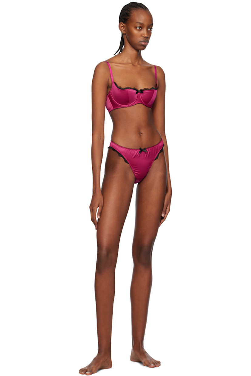 Stretch polyester satin briefs. Scalloped lace trim throughout.

· Elasticized waistband 
· Bow appliqué at front
· Partial cotton jersey lining

Supplier color: Fuchsia/Black
