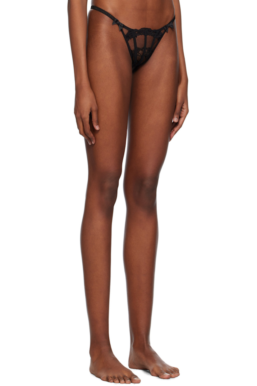 Semi-sheer nylon tulle thong. Lace trim throughout.

· Elasticized waistband
· Bow appliqués at front 
· Partial cotton jersey lining

Supplier color: Black