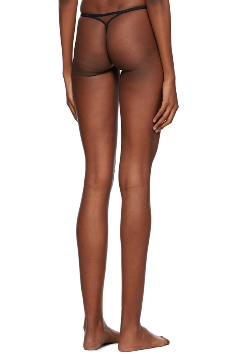 Semi-sheer nylon tulle thong. Lace trim throughout.

· Elasticized waistband
· Bow appliqués at front 
· Partial cotton jersey lining

Supplier color: Black