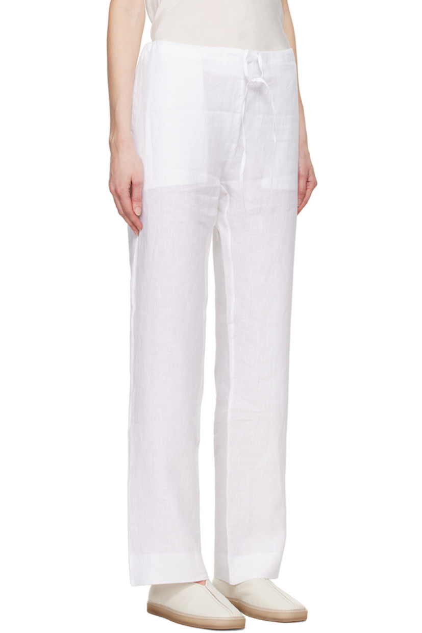 Handmade slub Solbiati® linen canvas trousers.

· Concealed drawstring at waistband
· Four-pocket styling

Part of the Serie No.12 collection.

Supplier color: White
