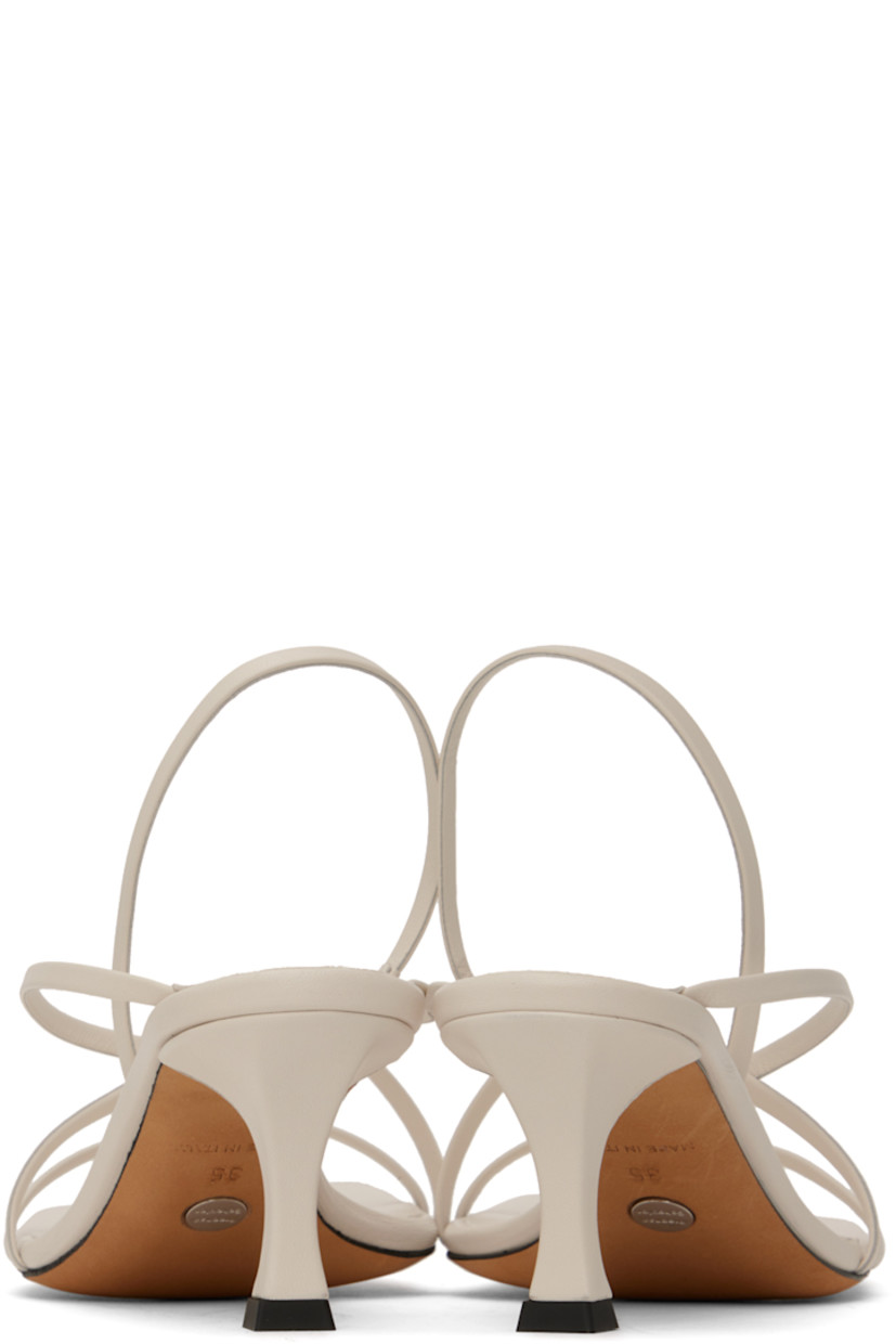 Buffed nappa lambskin heeled sandals in white. 

· Open square toe
· Criss-crossing straps at vamp
· Partially elasticized pin-buckle slingback strap
· Logo embossed at padded leather footbed
· Covered stiletto heel with rubber injection
· Suede sole
· Heel: H2.5"

Supplier color: Natural