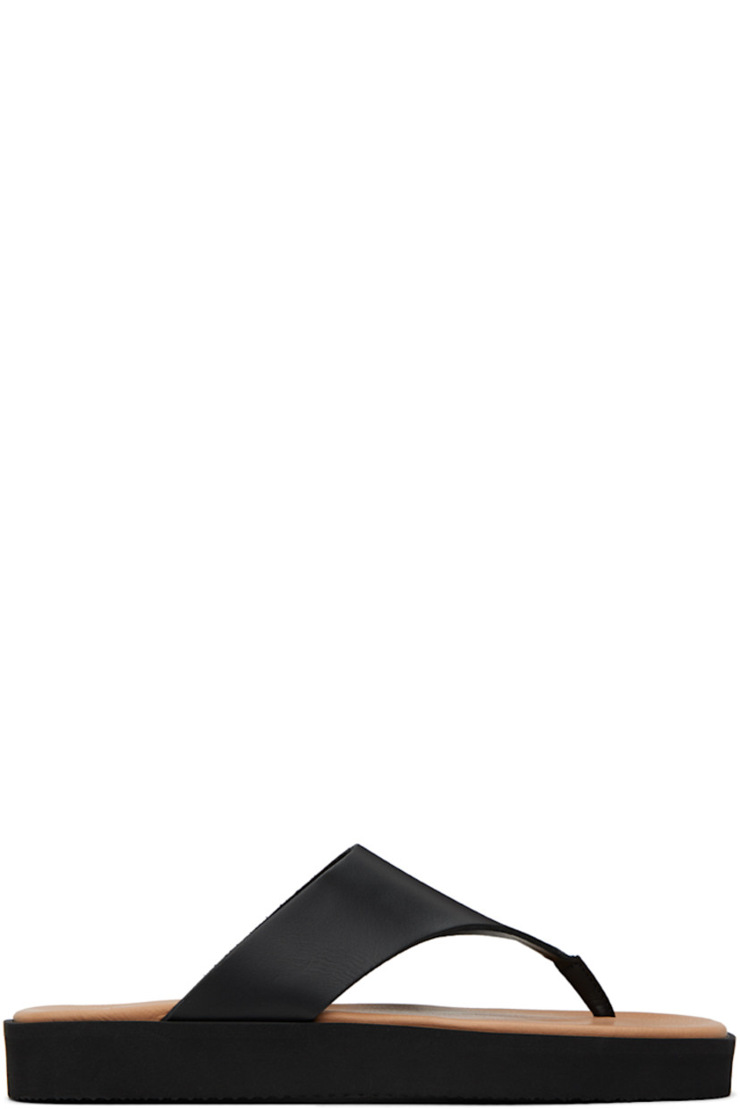 LWG-certified buffed leather sandals in black.

· Open square toe
· Thong-style strap at vamp
· Logo embossed at padded leather footbed
· Treaded foam rubber sole

Supplier color: Black