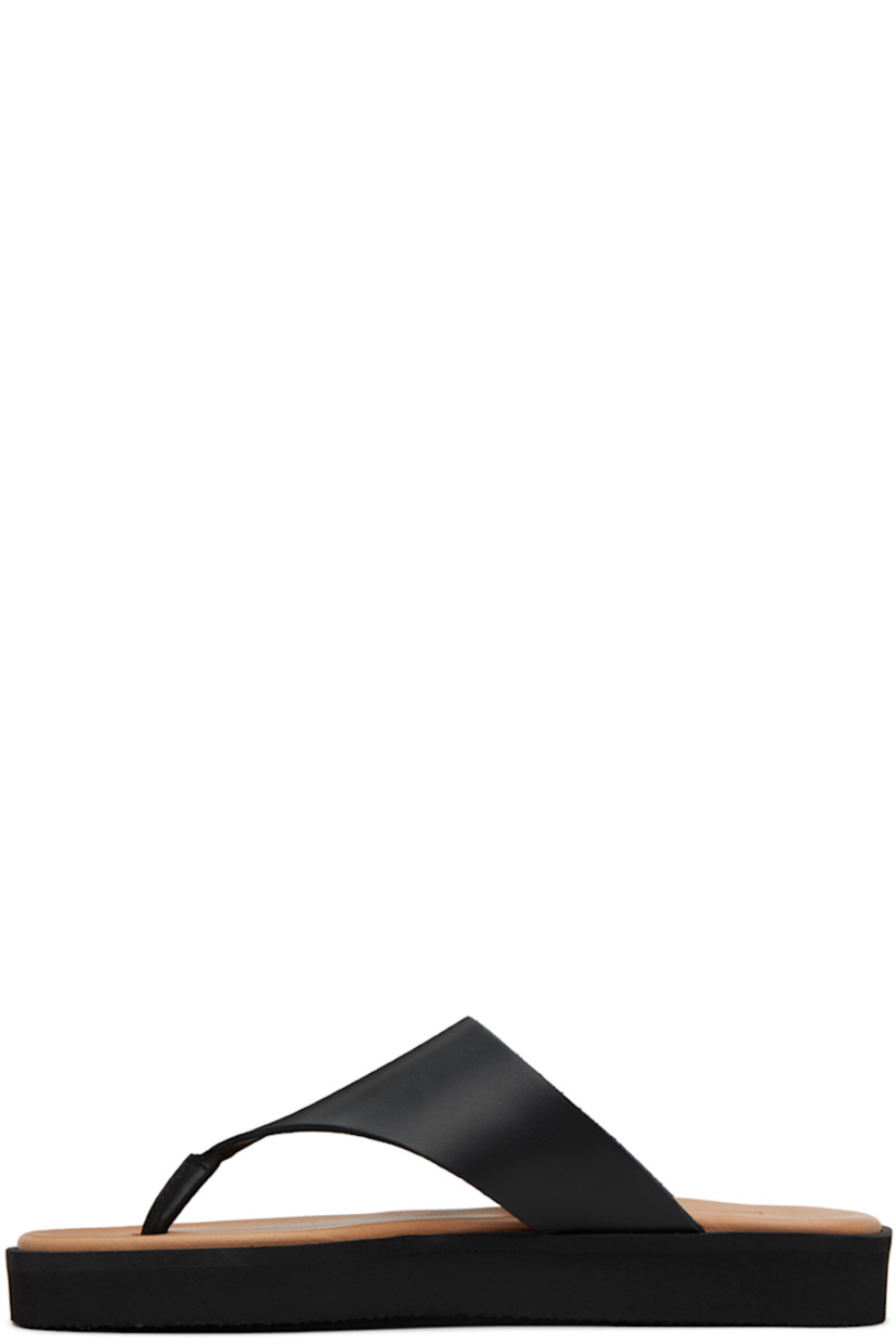 LWG-certified buffed leather sandals in black.

· Open square toe
· Thong-style strap at vamp
· Logo embossed at padded leather footbed
· Treaded foam rubber sole

Supplier color: Black