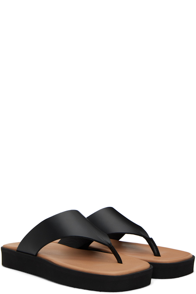 LWG-certified buffed leather sandals in black.

· Open square toe
· Thong-style strap at vamp
· Logo embossed at padded leather footbed
· Treaded foam rubber sole

Supplier color: Black