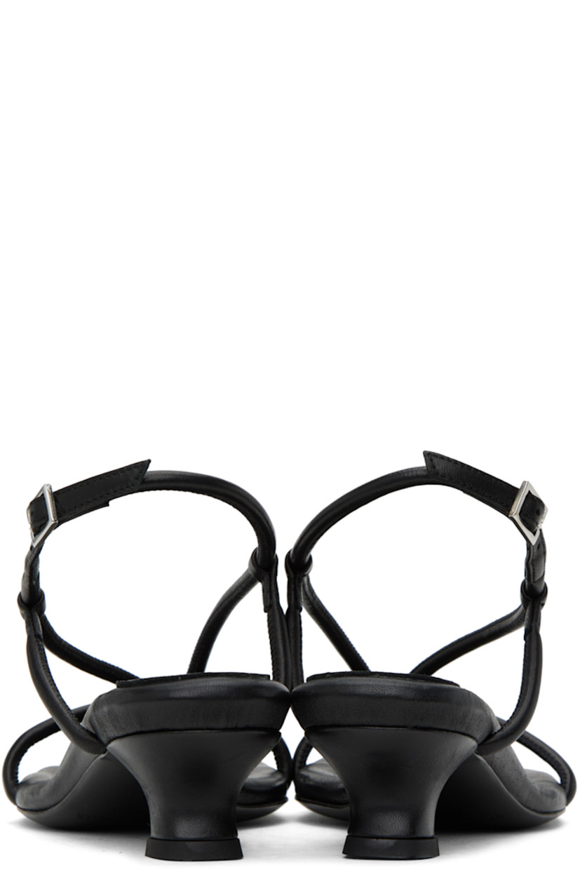 Padded LWG-certified grained leather heeled sandals in black.

· Open square toe
· Thong-style strap at vamp
· Pin-buckle slingback strap
· Logo embossed at leather footbed
· Covered kitten heel with rubber injection
· Leather sole with rubber injection
· Heel: 2"

Supplier color: Black
