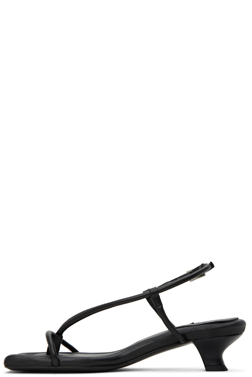 Padded LWG-certified grained leather heeled sandals in black.

· Open square toe
· Thong-style strap at vamp
· Pin-buckle slingback strap
· Logo embossed at leather footbed
· Covered kitten heel with rubber injection
· Leather sole with rubber injection
· Heel: 2"

Supplier color: Black