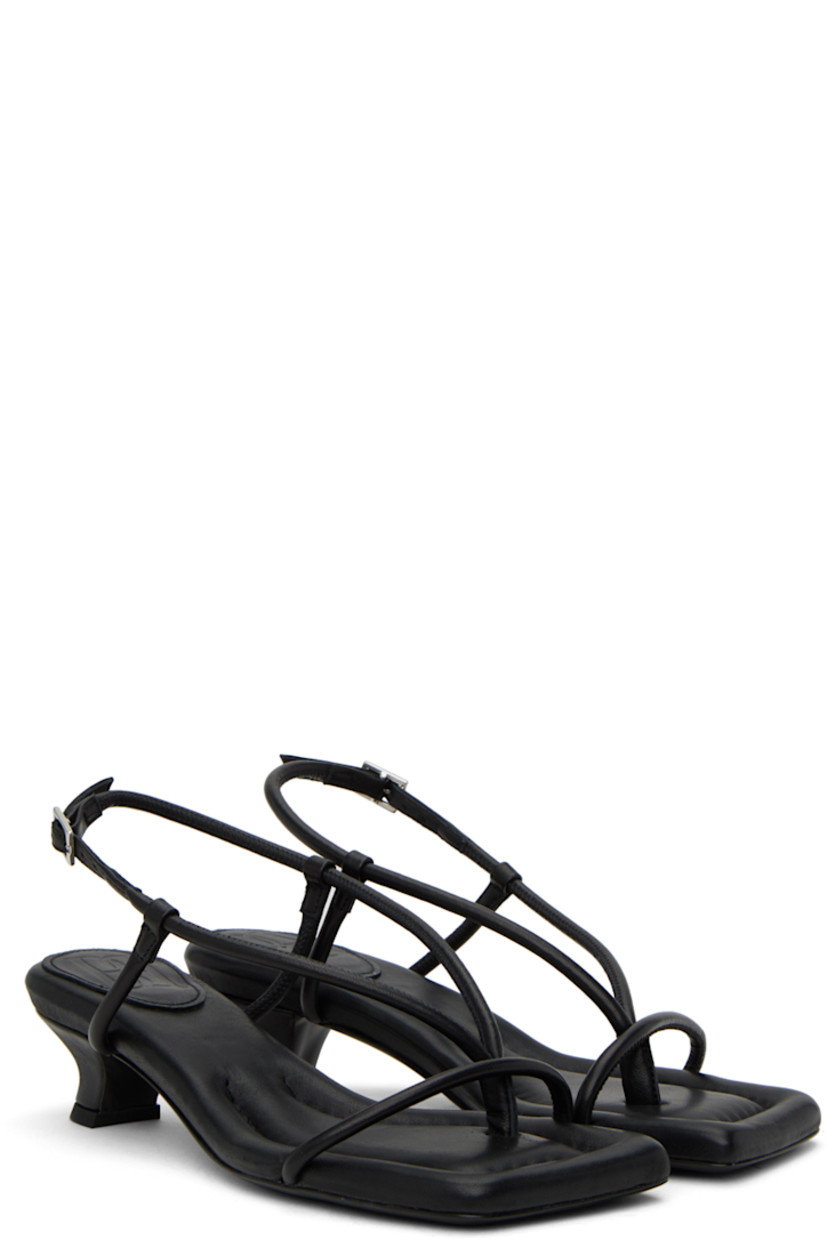 Padded LWG-certified grained leather heeled sandals in black.

· Open square toe
· Thong-style strap at vamp
· Pin-buckle slingback strap
· Logo embossed at leather footbed
· Covered kitten heel with rubber injection
· Leather sole with rubber injection
· Heel: 2"

Supplier color: Black