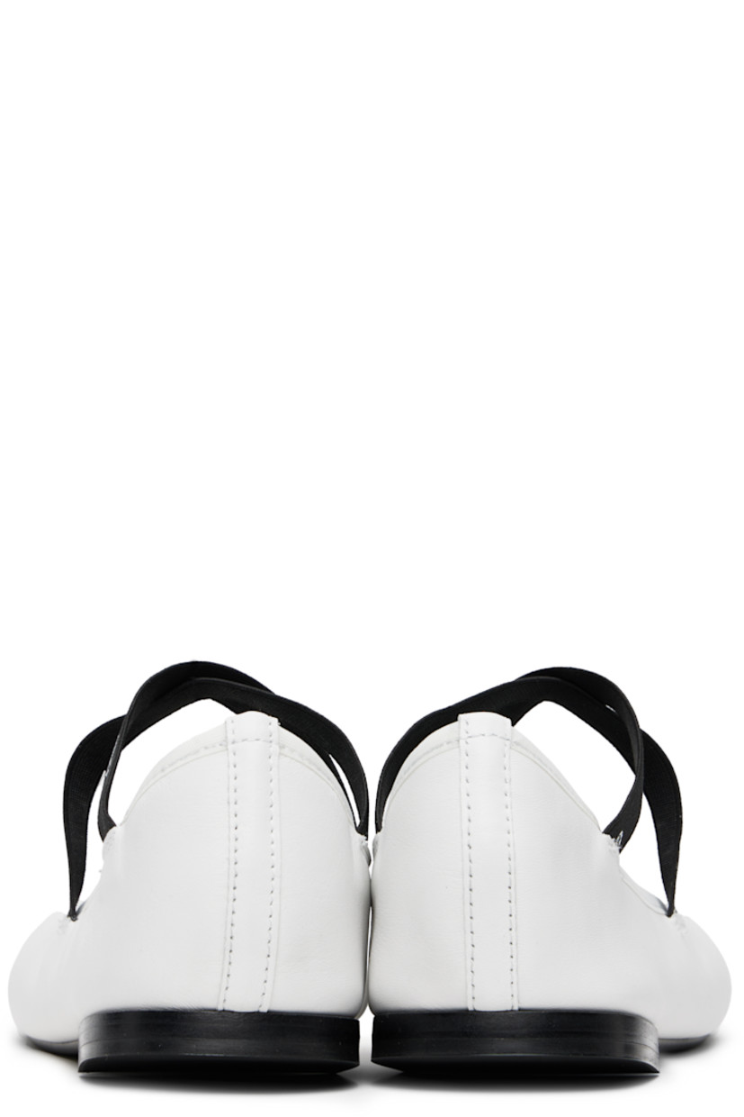Grained nappa calfskin Mary Jane-style ballerina flats in white.

· Logo-printed crisscrossing elasticized straps at vamp
· Grosgrain trim at collar
· Grained lambskin lining
· Stacked leather heel with rubber injection
· Rubber sole

Supplier color: Blanc
