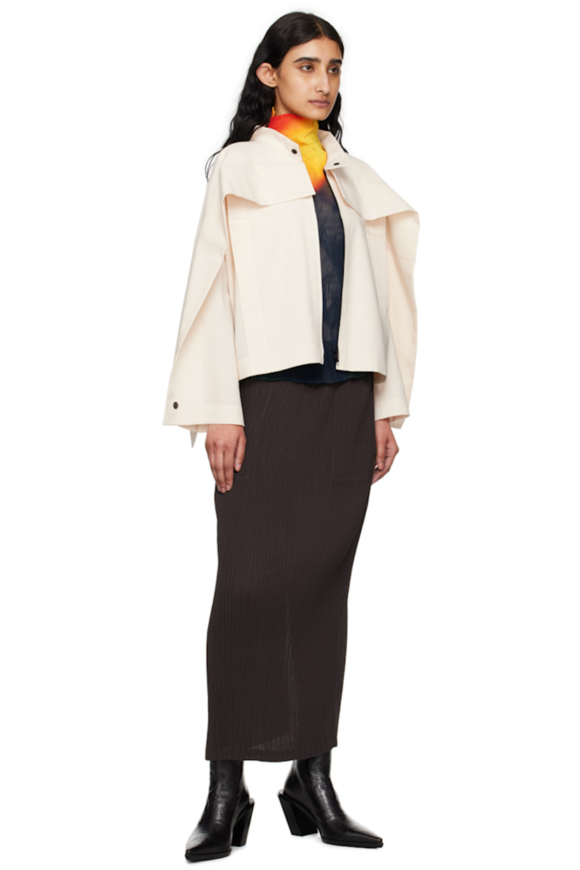 Polyester canvas jacket.

· Press-stud fastening at band collar
· Zip closure
· Foldover panel at chest, back, and back sleeves
· Welt pockets
· Press-stud fastening at hem and cuffs
· Unlined

Supplier color: Ivory
