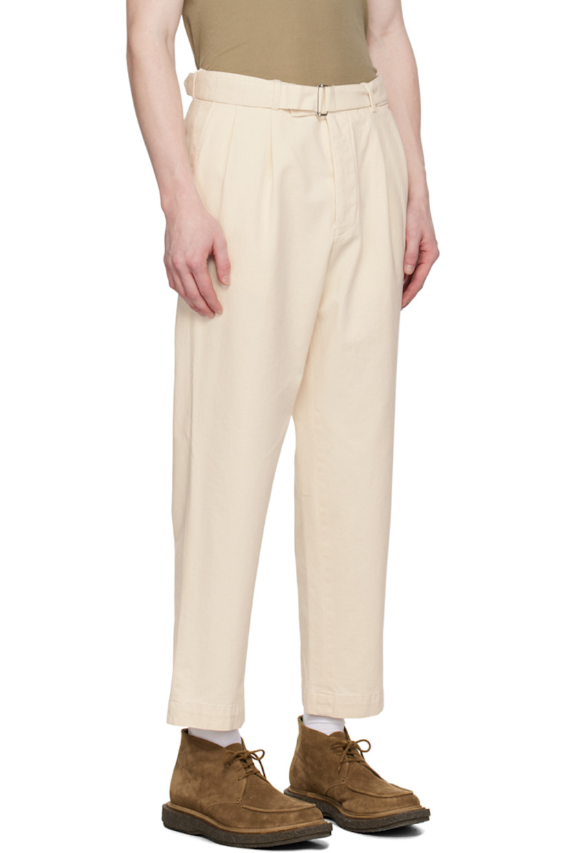 Tapered garment-dyed GOTS-certified organic cotton- and pre-consumer recycled cotton-blend twill trousers. 

· Detachable cinch belt at waistband
· Belt loops
· Four-pocket styling
· Button-fly
· Pleats at front
· Partially lined
· Horn hardware 

Supplier color: Ecru