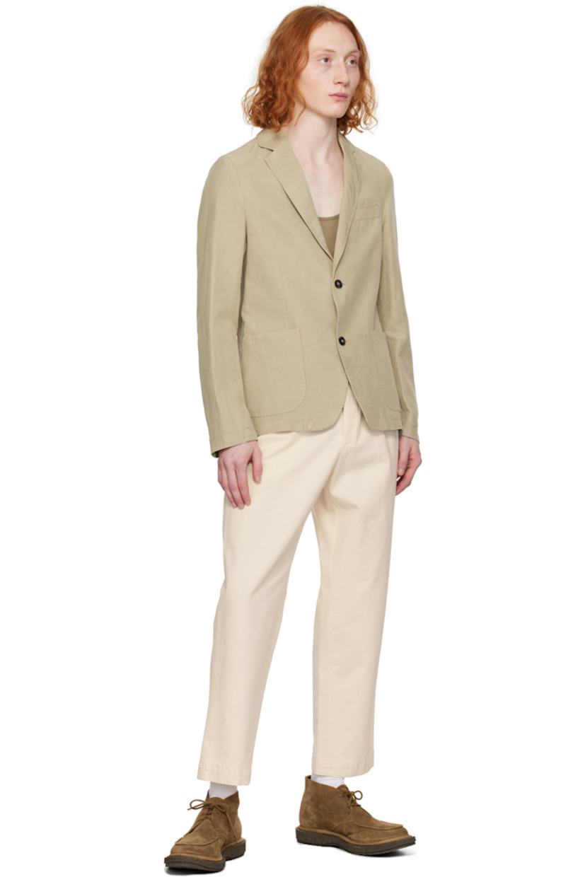 Tapered garment-dyed GOTS-certified organic cotton- and pre-consumer recycled cotton-blend twill trousers. 

· Detachable cinch belt at waistband
· Belt loops
· Four-pocket styling
· Button-fly
· Pleats at front
· Partially lined
· Horn hardware 

Supplier color: Ecru