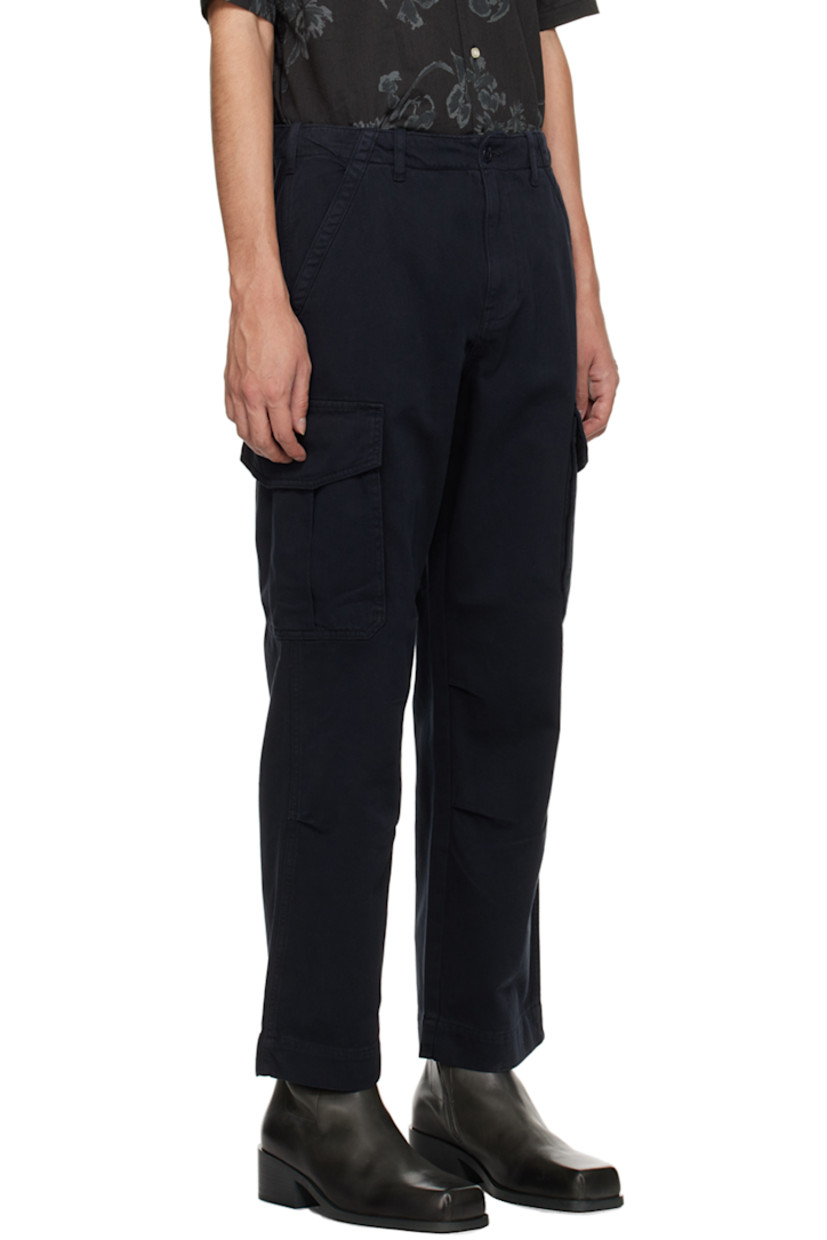 Garment-dyed cotton twill cargo pants.

· Belt loops
· Four-pocket styling
· Zip-fly
· Darts at knees
· Cargo pocket at outseams

Supplier color: Dark navy