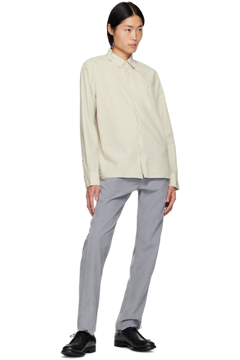 Crinkled garment-dyed lyocell- and cotton-blend poplin shirt. 

· Spread collar
· Button closure
· Patch pocket at chest 
· Tennis-tail hem
· Single-button barrel cuffs

Supplier color: Stone