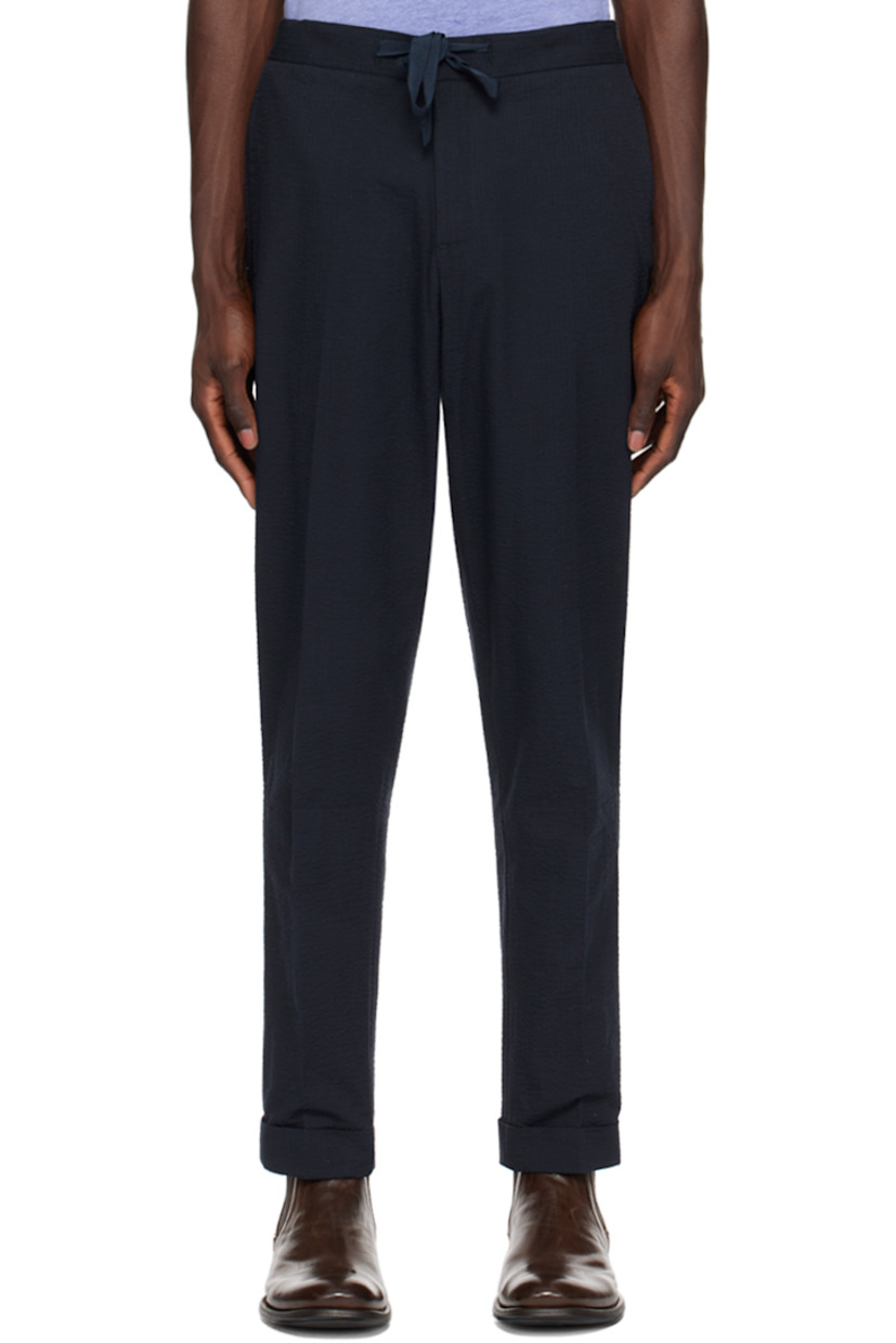 Loose-fit straight-leg reactive-dyed cotton seersucker trousers.

· Drawstring at partially elasticized waistband
· Four-pocket styling
· Zip-fly
· Creased legs

Supplier color: Navy