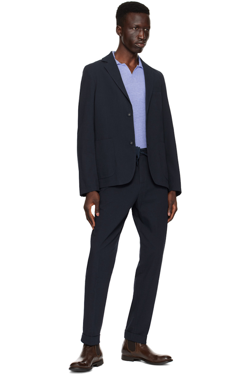 Loose-fit straight-leg reactive-dyed cotton seersucker trousers.

· Drawstring at partially elasticized waistband
· Four-pocket styling
· Zip-fly
· Creased legs

Supplier color: Navy