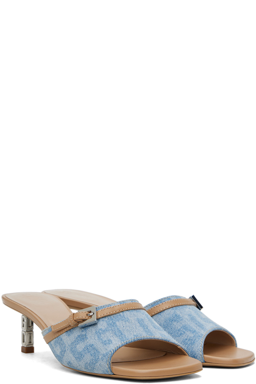 Non-stretch denim slip-on heeled sandals in blue and beige. 

· Buffed calfskin trim and fading throughout
· Open square toe
· Pin-buckle strap at vamp
· Logo embossed at buffed calfskin footbed
· Buffed calfskin lining
· Metal kitten heel with rubber injection
· Logo hardware at heel
· Polished leather sole 
· Logo-engraved silver-tone hardware
· Heel: H1.25"

Supplier color: Light blue