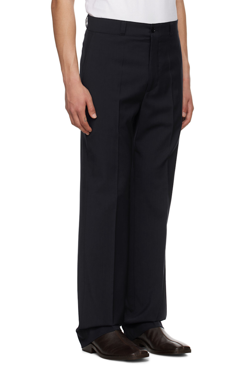Handcrafted plain-woven tropical virgin wool trousers. 

· Belt loops
· Four-pocket styling
· Zip-fly
· Creased legs

Supplier color: Navy